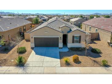 Charming single-Gathering home featuring a well-manicured desert landscape and a two-car garage at 25601 W Coles Rd, Buckeye, AZ 85326