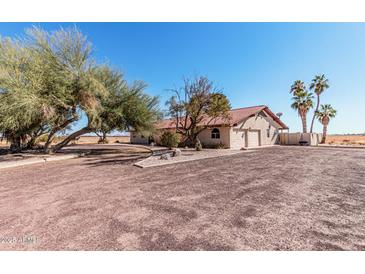 Spacious single-story home with desert landscaping, a tile roof, and an attached two-car garage at 3279 E Selma Hwy, Casa Grande, AZ 85194