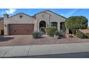 Charming single-story home featuring a well-manicured front yard and a two-car garage at 4424 N Potomac Dr, Florence, AZ 85132