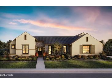 Charming home with a stone-accented facade, lush landscaping, and a welcoming walkway to the front door at 10242 N 58Th St, Paradise Valley, AZ 85253