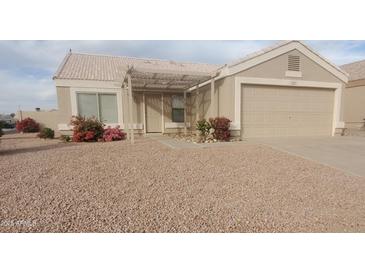 Charming single-story home with desert landscaping and a covered entryway at 11184 W Royal Palm Rd, Peoria, AZ 85345