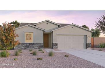 Charming single-Gathering home with stone accents and a two-car garage at 12638 W Parkway Ln, Avondale, AZ 85323