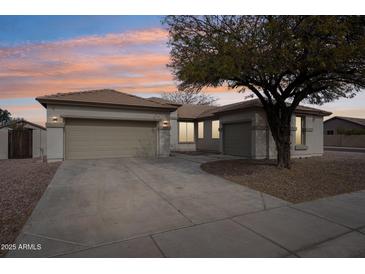 Charming single-story home featuring a well-manicured lawn and a spacious three-car garage at 2520 W Minton St, Phoenix, AZ 85041