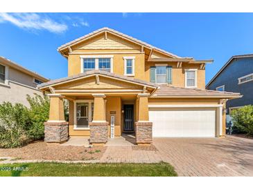 Charming two-story home with a covered front porch and a well-maintained front yard at 3548 E Mesquite St, Gilbert, AZ 85296