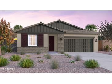 Charming single-story home featuring a neutral color scheme, brick accents, and well-maintained landscaping at 10308 S Bickwell Trl, Apache Junction, AZ 85120