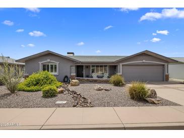 Charming single-story home showcasing a low maintenance front yard and attached two-car garage at 5061 E Edgewood Ave, Mesa, AZ 85206