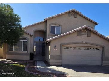 Charming two-story home with a well-maintained lawn and two car garage at 849 W Spur Ave, Gilbert, AZ 85233