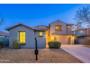 Charming two-story home with a well-manicured front yard and attached two-car garage at 1737 E Azalea Dr, Gilbert, AZ 85298