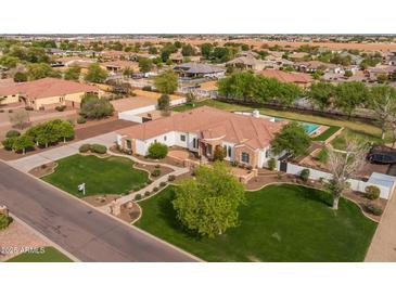 Stunning aerial view of a single-Gathering home with lush landscaping, pool, and charming curb appeal in a desirable neighborhood at 21442 E Excelsior Ave, Queen Creek, AZ 85142