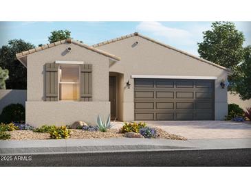 Charming single-story home featuring desert landscaping, and a two-car garage at 24369 W La Salle St, Buckeye, AZ 85326