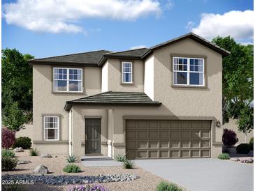 Stunning two-story home features a neutral palette, a two-car garage, and low maintenance desert landscaping at 24190 W Hidalgo Ave, Buckeye, AZ 85326