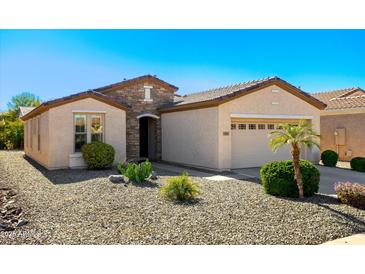 Charming single-story home with stone accents, desert landscaping and a two-car garage at 4627 E Sourwood Dr, Gilbert, AZ 85298