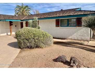 Charming single-story home featuring a well-manicured front yard with low-maintenance desert landscaping at 537 N Jay St, Chandler, AZ 85225