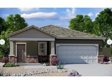 Charming single-story home with stone accents, desert landscaping, and a two-car garage at 6130 E Artemis Dr, Florence, AZ 85132