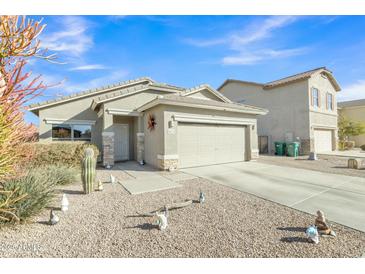 Charming single-story home featuring a low maintenance yard and attached two-car garage at 18230 E El Viejo Desierto --, Gold Canyon, AZ 85118