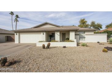 Charming single-story home with desert landscaping, neutral colors, and a two-car garage at 4434 W Dahlia Dr, Glendale, AZ 85304
