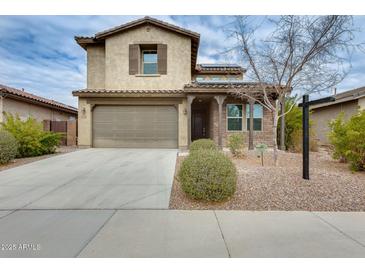 Charming two-story home with desert landscaping, two-car garage and neutral-toned stucco at 12246 W Paso Trl, Peoria, AZ 85383