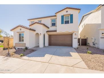 Charming two-story home with a two car garage, low maintenance yard and neutral color scheme at 2180 N Iowa St, Chandler, AZ 85225