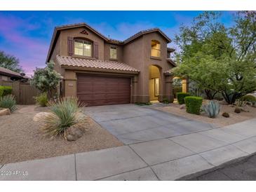 Charming two-story home featuring a tile roof and a spacious two-car garage at 3419 W Thoreau Ln, Anthem, AZ 85086