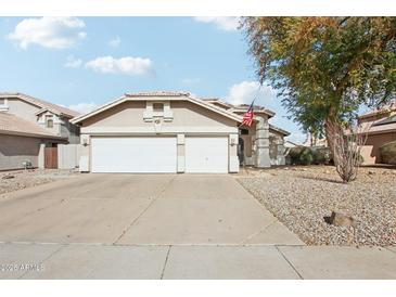 Charming single-story home with a spacious two-car garage and well-maintained desert landscaping at 698 W Merrill Ave, Gilbert, AZ 85233