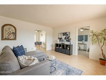 Inviting living room offering neutral colors, tile floors, and an open concept layout at 8038 S 25Th St, Phoenix, AZ 85042