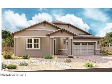 Charming single-story home with a two-car garage and low maintenance desert landscaping at 21936 E Saddle E Ct, Queen Creek, AZ 85142