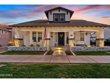 Charming single-Gathering home with a welcoming porch and well-manicured lawn in a peaceful neighborhood at 2733 E Virginia St, Gilbert, AZ 85296