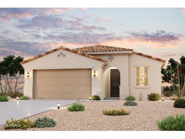 Charming single-story home with desert landscaping, tile roof, and a two-car garage at 3456 S 177Th Ave, Goodyear, AZ 85338