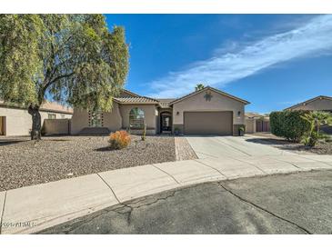 Charming single-story home with desert landscaping, a two-car garage, and a covered entryway at 5225 S Opal Pl, Chandler, AZ 85249