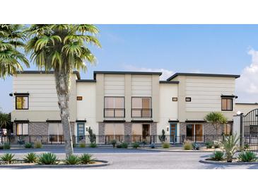 Modern townhome exterior with a mix of sleek stucco and stylish stone accents at 651 N Ironwood Dr # 2, Apache Junction, AZ 85120