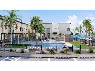 Community pool area featuring lounge seating and lush landscaping for relaxing outdoors at 651 N Ironwood Dr # 4, Apache Junction, AZ 85120