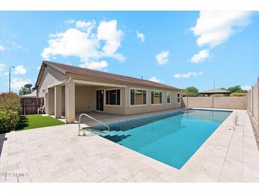 Backyard featuring a beautiful private pool and covered patio at 10630 W Pinchot Ave, Avondale, AZ 85392