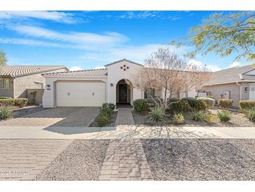 Charming single-story home with a well-manicured front yard and inviting arched entryway at 10633 E Sheffield Dr, Mesa, AZ 85212