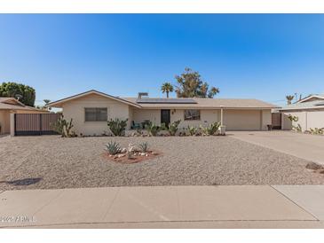 Charming single-story home featuring a well-maintained desert landscaped front yard at 11468 N Desert Hills Dr, Sun City, AZ 85351