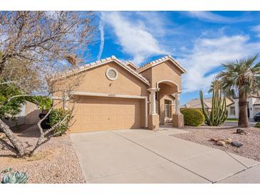 Charming single-Gathering home with a well-maintained front yard, desert landscaping, and a two-car garage at 15237 S 47Th Way, Phoenix, AZ 85044