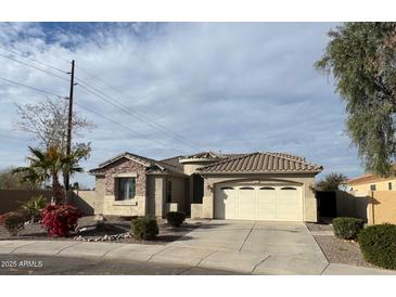 Charming single-story home featuring desert landscaping, a two-car garage, and a tile roof at 2010 E Indigo Dr, Chandler, AZ 85286