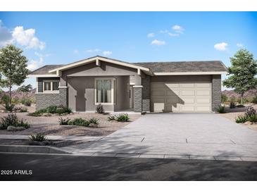 Charming single-story home with a desert landscape, brick accents, and a two-car garage at 44721 N 44Th Dr, Phoenix, AZ 85087