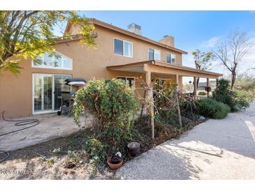 Charming two-story home with a covered patio and a landscaped yard at 7100 E Montgomery Rd, Scottsdale, AZ 85266