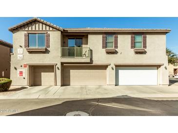 Inviting townhome with multiple garage spaces and balcony at 1458 N 80Th Ln, Phoenix, AZ 85043