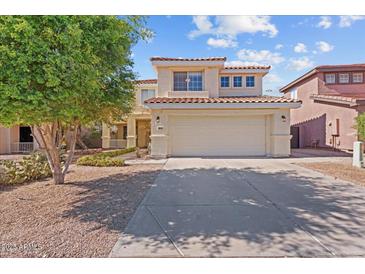 Charming two-story home with a well-maintained front yard and a two-car garage at 16618 S 28Th Pl, Phoenix, AZ 85048