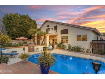 Inviting backyard pool, lush landscaping, and a tranquil patio create a perfect outdoor oasis at 3482 W Shannon St, Chandler, AZ 85226