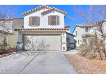 Charming two-story home with a spacious two-car garage and beautiful desert landscaping at 40564 W Nicole Ct, Maricopa, AZ 85138