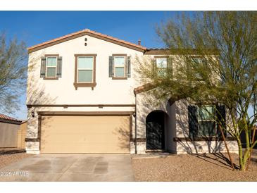 Charming two-story home features a neutral color palette, attached two car garage and landscaped yard at 27 N 199Th Ave, Buckeye, AZ 85326