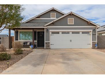 Charming single-Gathering home boasts a well-manicured front yard and attached two-car garage at 5030 S 23Rd Ave, Phoenix, AZ 85041