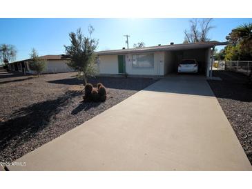 Charming single-story home with desert landscaping and a covered carport in a quiet neighborhood at 120 N 54Th St, Mesa, AZ 85205