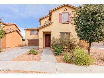 Charming home featuring a well-maintained yard, desert landscaping, and an inviting front entrance at 2075 S Ponderosa Dr, Gilbert, AZ 85295