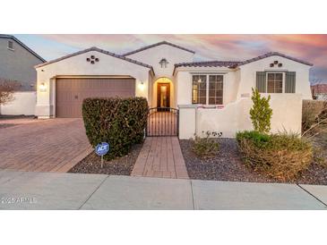 Charming single-story home featuring a well-manicured front yard and a two-car garage at 4455 S Matter --, Mesa, AZ 85212