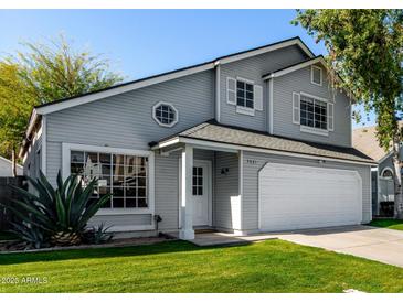 Charming two-story home with gray siding, white trim, and well-maintained landscaping at 5021 W Chicago N Cir, Chandler, AZ 85226