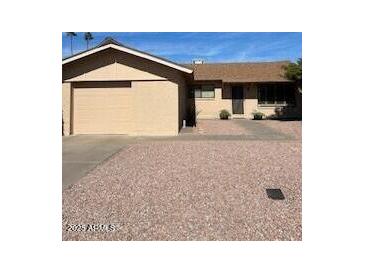 Charming single-story home with a two-car garage and low-maintenance landscaping at 8538 E Vista Dr, Scottsdale, AZ 85250