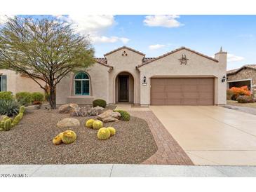 Charming single-story home featuring desert landscaping and a two-car garage at 26234 W Matthew Dr, Buckeye, AZ 85396